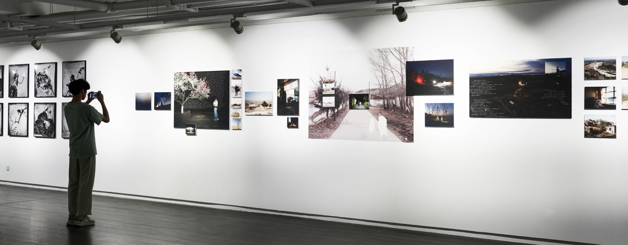 Visitors viewing Where Roads Begin to Split in an exhibition